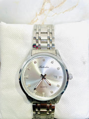 Faleda luxury silver quartz watch with diamond hour markers and metal link bracelet on white cushion