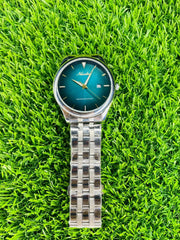 Nuodun waterproof quartz watch with blue dial and silver metal strap on green grass