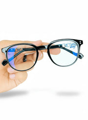 Hand holding premium black frame blue light blocking glasses with anti-reflective lenses